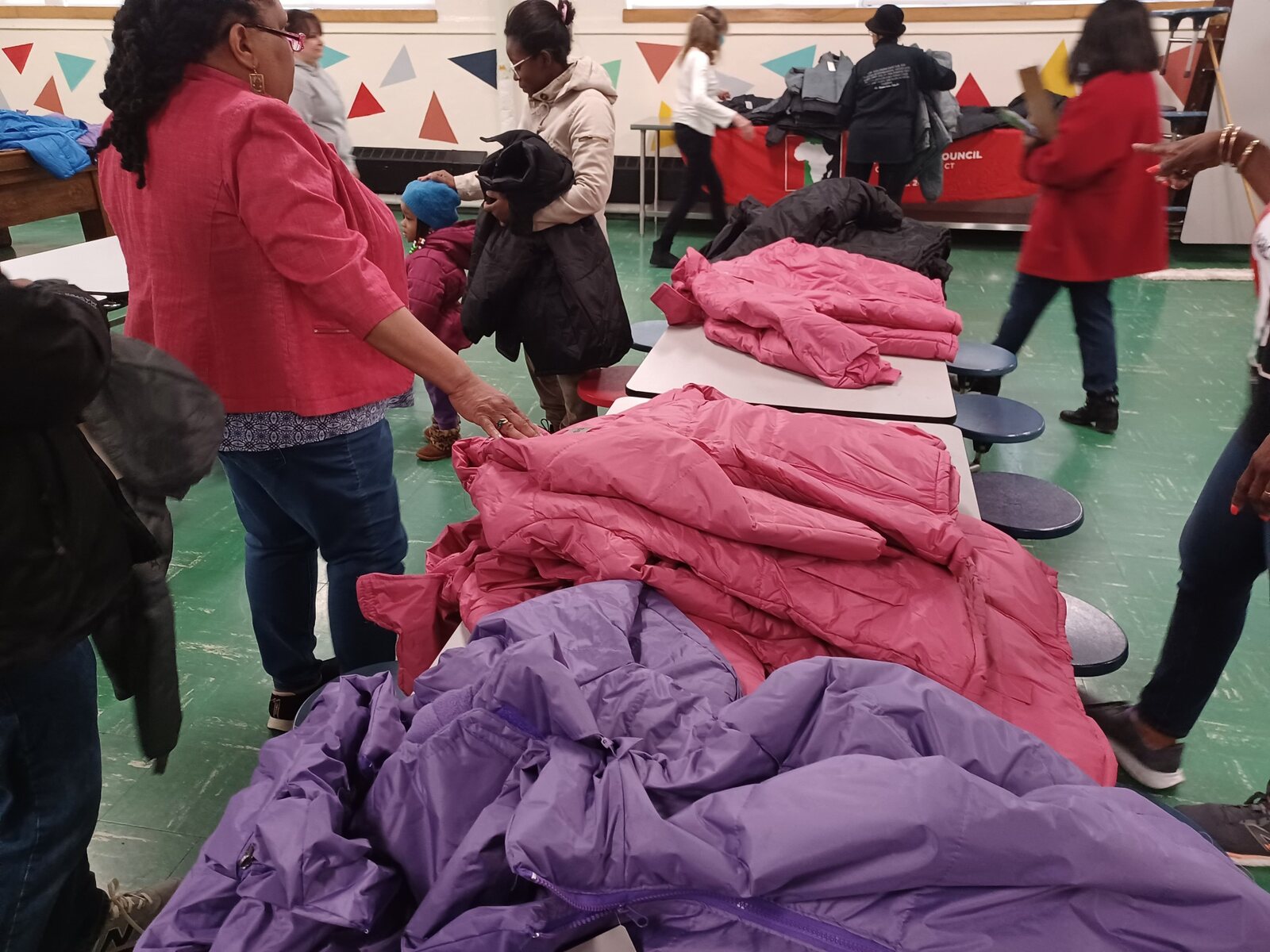 Winter coats prepared for distribution at a SCRIP community event