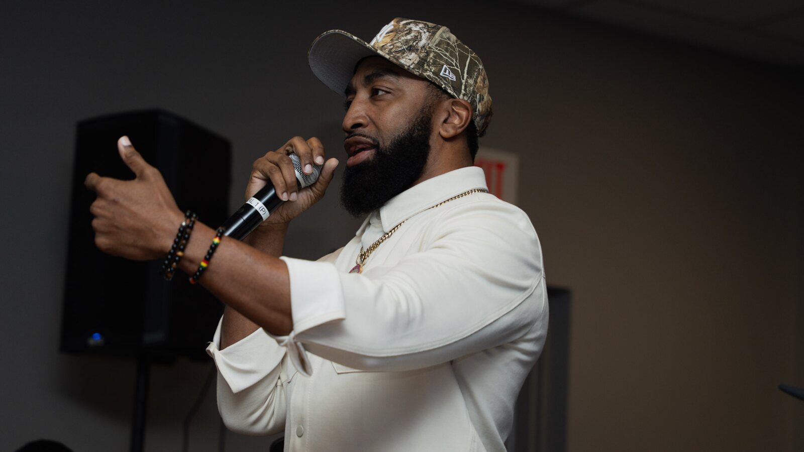 Rap artist and activist Mysonne speaking at a SCRIP event