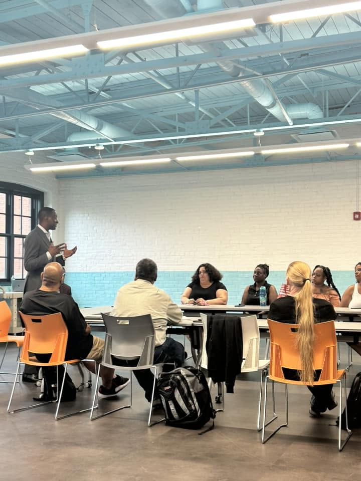A SCRIP community conversation with participants seated around tables