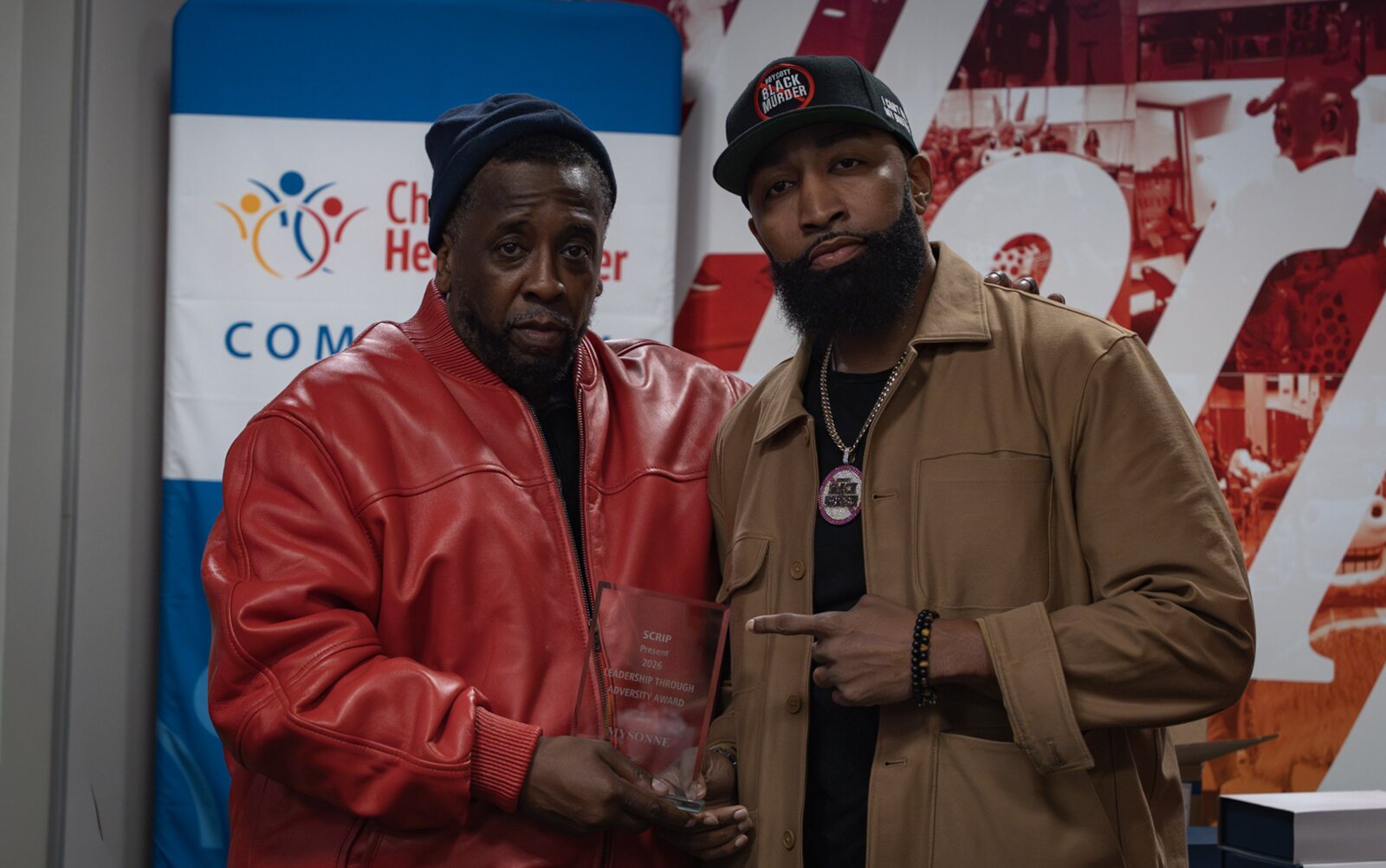 Edward Andrews presenting artist and activist Mysonne with a SCRIP award